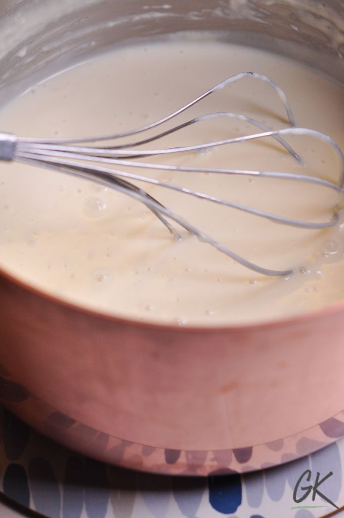 Cauliflower & Kale macaroni cheese with whisk